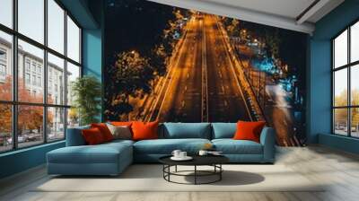 A brightly lit highway stretches towards a towering cityscape, with the glowing number 2025, symbolizing the modern journey and urban growth beneath a night sky. Wall mural