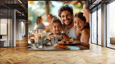 Mand and woman parents with two children having lunch at terrace Wall mural