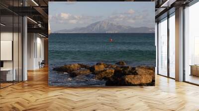 Sagrado corazon de Jesus landmark statue in Tarifa on the seashore of the Atlantic with view to Morocco at Strait of Gibraltar on a bright sunny day Wall mural