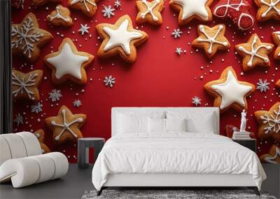 This image features an assortment of star-shaped cookies, beautifully decorated in festive styles with red and white icing, placed on a vibrant red background, ideal for holiday cheer. Wall mural