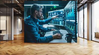 Two corporate white data analysts working together in office with computer looking at screen with data chart graph Wall mural