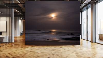 Moonlight reflected on ocean at night. Long exposure. Wall mural