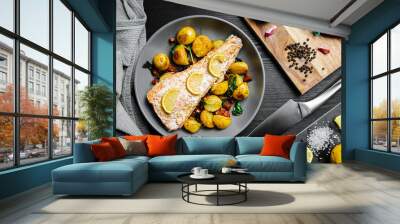 Fillet of salmon oven-baked with hand-made lemon and garlic butter, served with sautéed baby potatoes with chorizo, garlic, and spinach. Wall mural