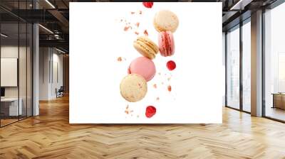 Sweet macaroons macarons with raspberry berries and crumbs flying isolated on  white background. Wall mural