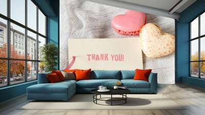 Thank you gift card with text and two macaroons in heart shape on light grey textile background. Wall mural