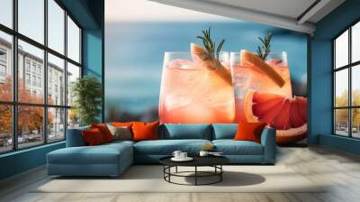 Grapefruit summer cocktail on sea background, a perfect blend of sweetness and citrus, Generative AI Wall mural