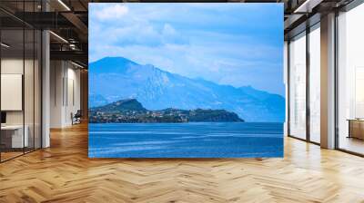 lake in the mountains with blue clouds and high rocks  Wall mural