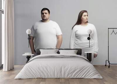 Overweight couple in white home clothes after an argument Wall mural