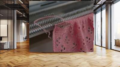 Manual knitting machine. A knitting machine is a device used to create knitted fabrics Wall mural