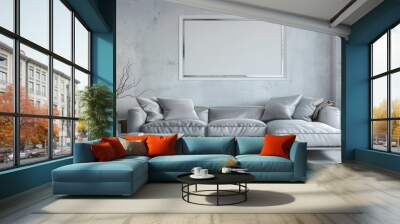 A modern living room featuring a sleek silver sofa and a blank white frame on the wall, exuding contemporary style. Wall mural