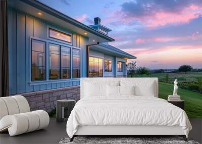 Pastel blue home during twilight, against a changing sky, with a blend of brick, stone, and green grass. Wall mural