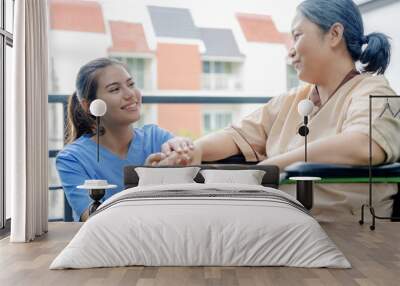 Caucasian Nurses assisting elderly people at retirement home. Wall mural