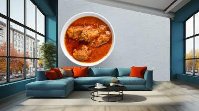 Overlay image of Nigerian Beef Stew in a white bowl on light grey background with negative space Wall mural