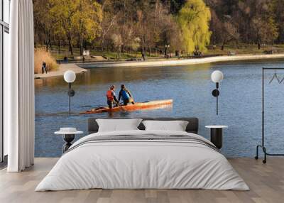 two girls are riding a kayak Wall mural