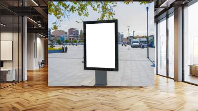 Blank mock up of vertical street poster billboard on city background Wall mural