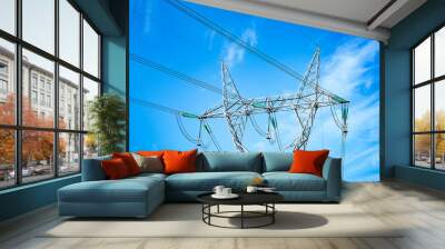 electricity transmission pylon silhouetted against blue sky at dusk Wall mural