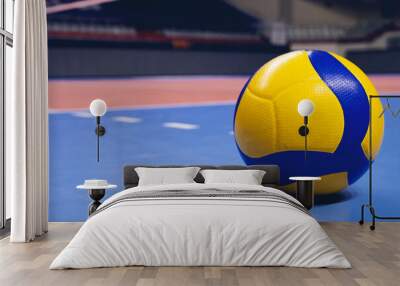 Volleyball ball on blurred wooden parquet background. Banner, space for text, close up view with details. Wall mural