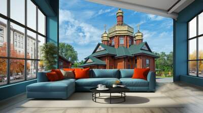 Small log church with three gilded domes Wall mural