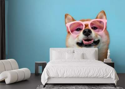 Joyful Ginger Shiba Inu Delighted in Pink Glasses on Blue Backdrop Wall mural