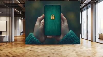 Person holds a cell phone with a lock on the screen which stands for cyber security Wall mural