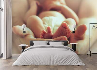 sleeping newborn baby on male hands Wall mural