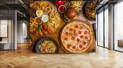 Assorted set from pizza Pepperoni, Assorted beer snacks, burger, wok and rice top view Wall mural