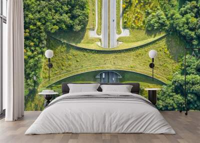 Aerial top down view of ecoduct or wildlife crossing - vegetation covered bridge over a motorway that allows wildlife to safely cross over Wall mural