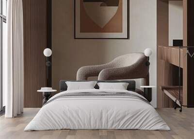 A beige armchair with a modern design in a minimalistic room with a framed abstract print on the wall. Wall mural