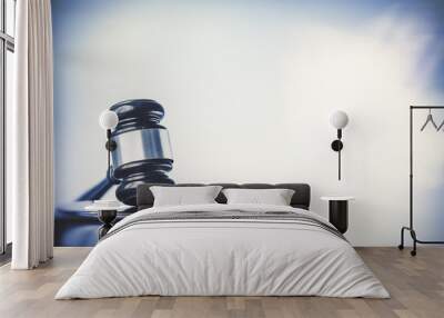 Law concept image, gavel set against bright computer monitor screen background Wall mural