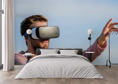 Different reality. guy virtual reality. male reality. looking so modern. macho man wear wireless VR glasses.. create own business. Digital future and innovation. sexy man sky background vr glasses Wall mural