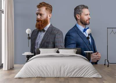 Elegant men in formalwear with bowtie. Two businessmen at business event. Tuxedo men in menswear isolated on grey. Tuxedo men in menswear. Tuxedo men wear menswear fashion. Tailored menswear Wall mural