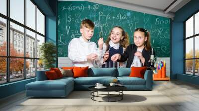 Fascinating chemistry. Group school pupils study chemistry in school. Boy and girls enjoy chemical experiment. Organic chemistry is study of compounds containing carbon. Basic chemical reactions Wall mural