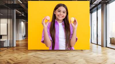 girl with macaroon. yummy macaroon dessert. teen girl savoring a macaron. Sweet tooth girl eat macaron. unhealthy french yummy cookie. french cookie of macaroon. girl enjoying flavor of macaron Wall mural