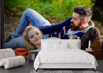 happy woman and bearded man drink mulled wine. camping and hiking. cheers. love date and romance. Family picnic. Love you more than yesterday. couple in love relax in autumn forest with tea or coffee Wall mural