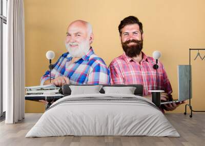 Old generation. bearded men. Vintage typewriter. father and son. family generation. retro typewriter vs laptop. New technology. technology battle. Modern life. youth vs old age. business approach Wall mural