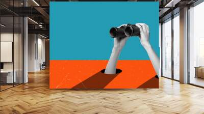 Art collage, hands holding binoculars on blue orange background. Wall mural