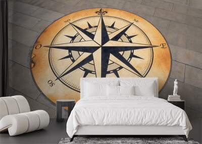 The compass is drawn on a concrete slab. Wall mural