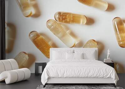 Gelatin golden light yellow capsules lying on a smooth surface, offering a clear view of their shape and texture, professional stock photo focused on pharmaceutical products.

 Wall mural