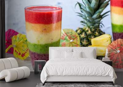 Colorful rainbow layered fruit smoothie Wall mural