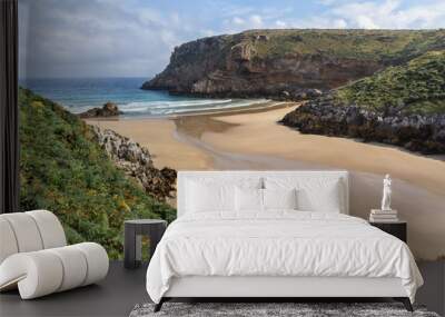 Las Fuentes beach on the coast of Cantabria in Spain seen from above on a sunny day with waves Wall mural