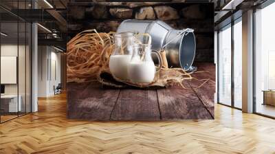 A jug of milk and glass of milk on a wooden table Wall mural