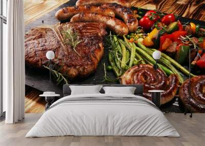 Assorted delicious grilled meat with vegetable on a barbecue with steak Wall mural