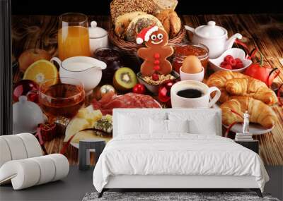 breakfast on table with bread buns, croissants, coffe and juice on christmas day. xmas holiday morning. Wall mural