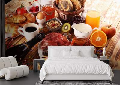 breakfast on table with bread buns, croissants, coffe and juice on new years eve Wall mural