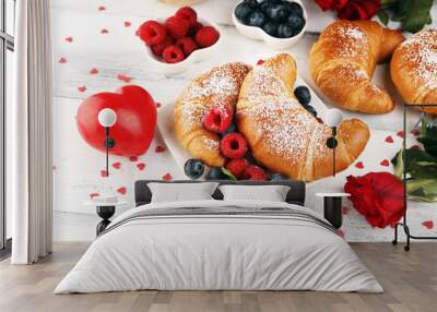 Delicious breakfast with fresh croissants and ripe berries and mint for valentines day Wall mural