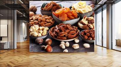 dried fruits and assorted nuts composition on rustic table Wall mural