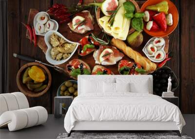 Italian antipasti wine snacks set. Cheese variety, Mediterranean olives, pickles, Prosciutto di Parma, tomatoes, artichokes Wall mural