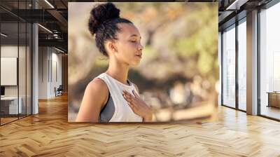 Black woman, breath and hand on chest, for meditation and wellness being peaceful to relax. Bokeh, African American female and lady outdoor, in nature and being calm for breathing exercise and health Wall mural