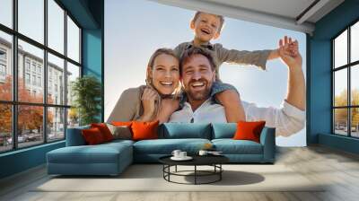 Family, mother and father with child, for holiday, vacation and being happy together outdoor. Portrait, mama and dad with kid for quality time, travel and bonding being loving, carry boy and have fun Wall mural