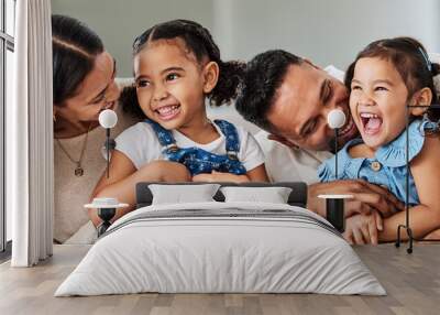 Love, care and parents with happy family of children laughing together at home in Puerto Rico. Mama, father and daughter siblings bonding in house with cheerful affection and excited smile. Wall mural